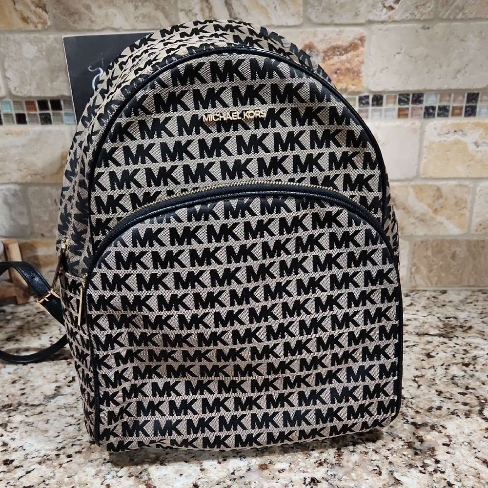Michael Kors Logo Patterned Backpack in Black and Tan